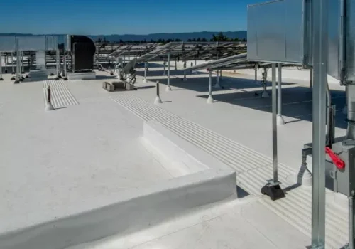 Commercial membrane roofing systems installation showing TPO, EPDM, or PVC membrane seaming on a large flat roof Roofing contractors in Clinton IA